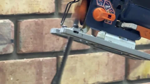 Electric jigsaw running in close up, power tool operating demonstration, Stock Footage 337117240