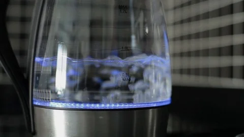 Electric kettle with blue highlight is boiling. Stock Footage 115860072