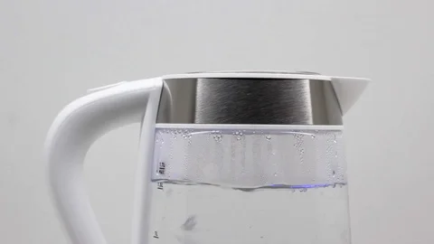 Electric Kettle. Water boiling with bubbles close-up Stock Footage 127171720