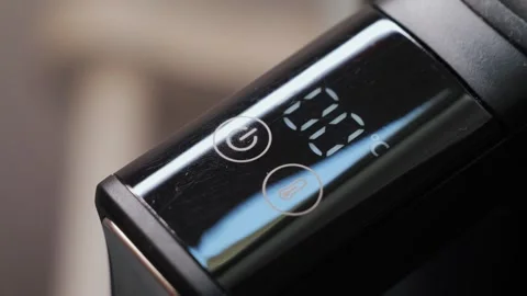 The electric kettles touch panel displays water temperature, making it Stock Footage 329668526