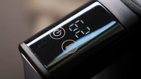 The electric kettles touch panel displays water temperature, making it Stock Footage 334315633