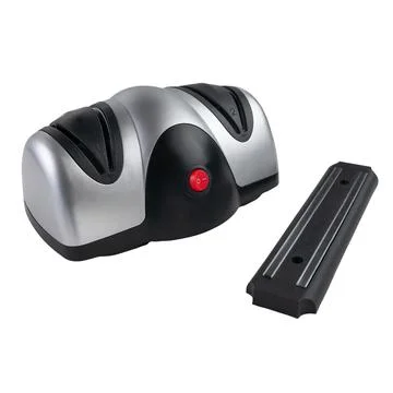 Electric knife sharpener. The plastic body is gray-black. Nearby is a magneti Stock Photos