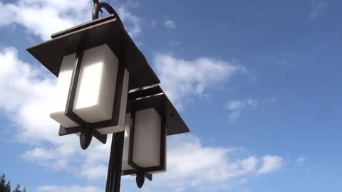 Electric light on a background of blue sky, Tima lapse Stock Footage 74596769