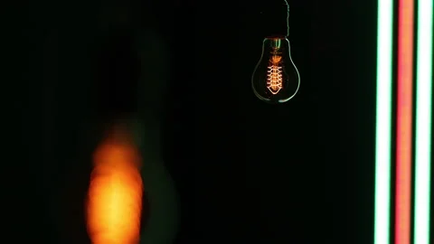 Electric light bulb on a black background. Stock Footage 154168401