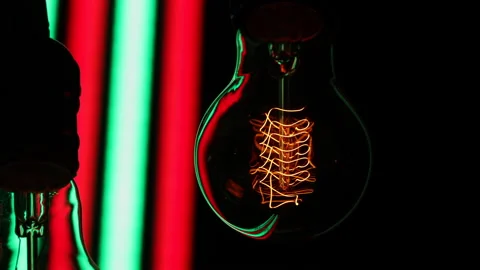 Electric light bulb on a black background. Stock Footage 154262457