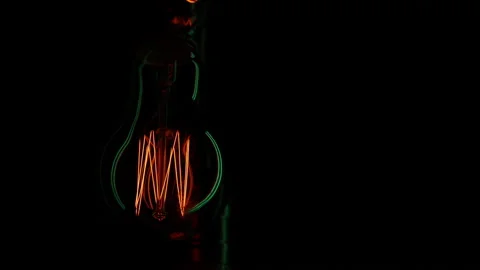 Electric light bulb on a black background. Stock Footage 154262484