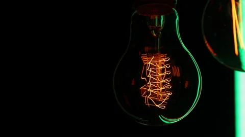 Electric light bulbs on a black background. Stock Footage 154168019