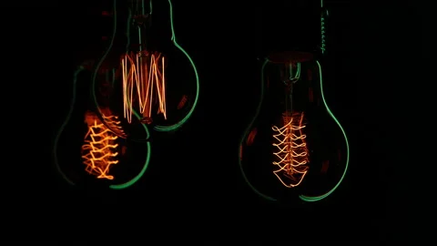 Electric light bulbs on a black background. Stock Footage 154168267