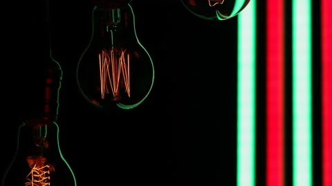 Electric light bulbs on a black background. Stock Footage 154168364