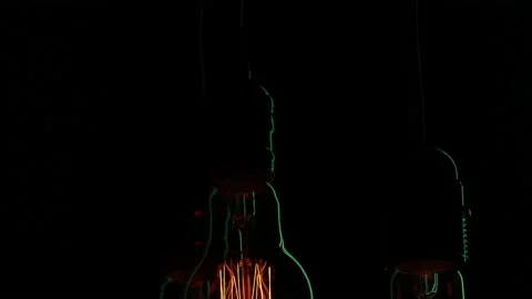 Electric light bulbs on a black background. Stock Footage 154262309