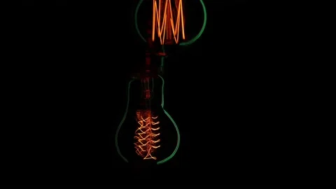 Electric light bulbs on a black background. Stock Footage 154262443