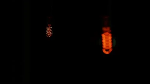 Electric light bulbs on a black background. Stock Footage 154262540