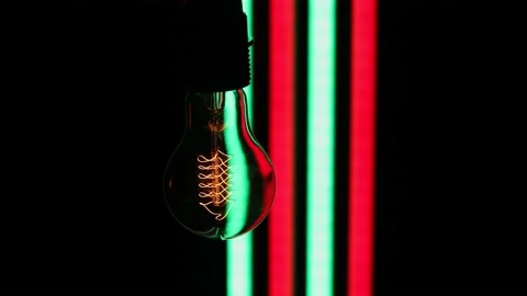 Electric light bulbs on a black background. Stock Footage