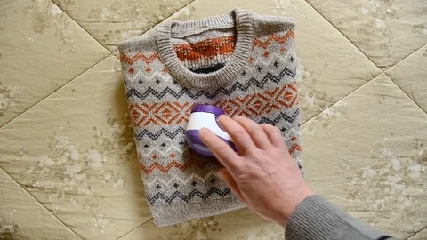 Electric lint remover Stock Footage 105229323