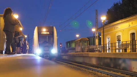 Electric locomotive making entry into outer commuter station Stock Footage 216641730