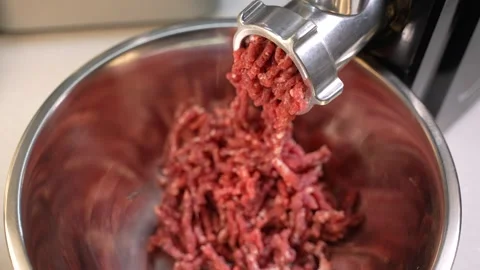 Electric meat grinder processes beef into minced Stock Footage 262635762