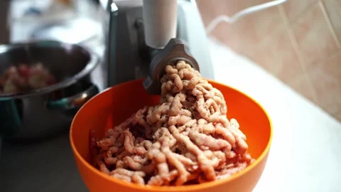 Electric meat grinder quickly grinds meat into minced meat Stock Footage 268698360