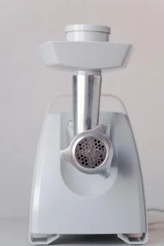 Electric meat grinder is on the table Photos