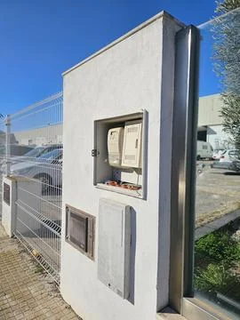 Electric Meter and Utility Boxes on Outdoor Wall Stock Photos