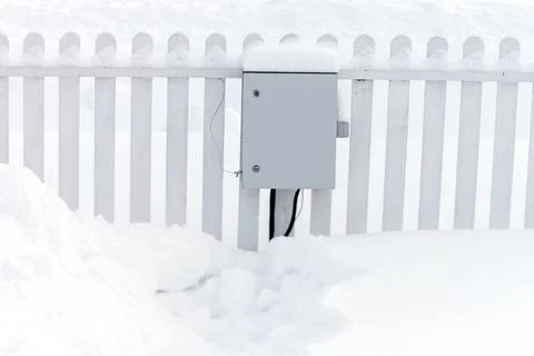 Electric meter box in winter 库存照片