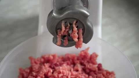 Electric mincer machine closeup. Grinder with fresh chopped meat. Stock Footage 135278924