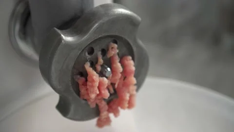 Electric mincer machine closeup. Grinder with fresh chopped meat. Stock Footage 135279036