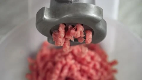 Electric mincer machine closeup. Grinder with fresh chopped meat. Stock Footage 135440137