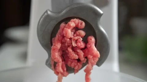 Electric mincer machine closeup. Grinder with fresh chopped meat. Stock Footage 135440168