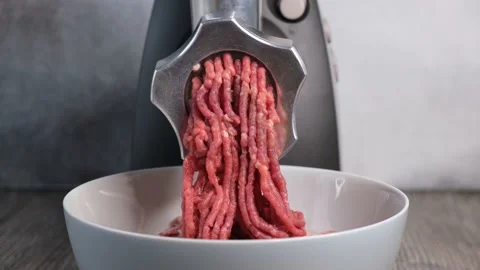 Electric mincer machine makes raw meat minced Stock Footage 143992114