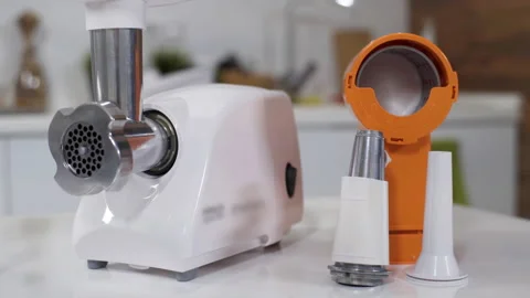 Electric mincer machine with vegetable cutter, sausage stuffing attachment Stock Footage 130247084