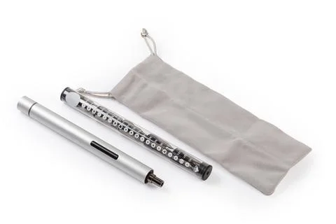 Electric mini screwdriver, case of interchangeable bits set, textile pouch Foto stock
