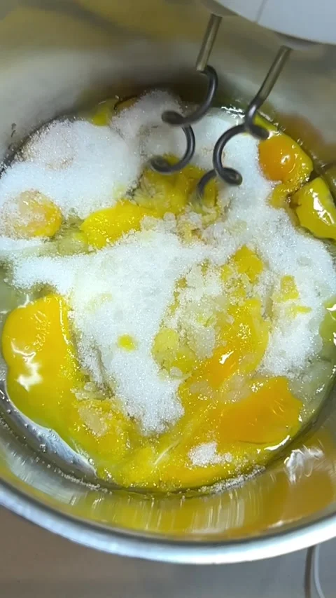 Electric Mixer Beating Eggs and Sugar into Fluffy Cream Slowmo Stock Footage 333040640