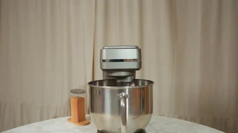 Electric Mixer Operating on Table Beside Wooden Kitchen Tool in Cozy Setting Stock Footage 307125015