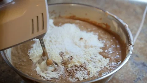 Electric Mixer preparing raw cookie dough and hot chocolate for baking Stock Footage 81879880