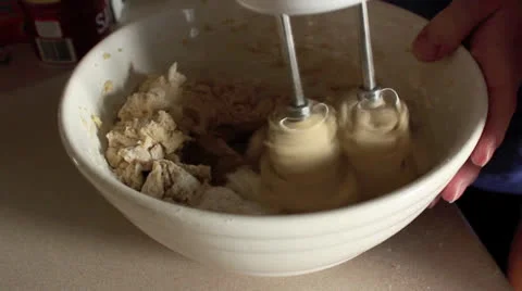 Electric Mixer Stirring Cookie Dough in a Bowl Stock Footage
