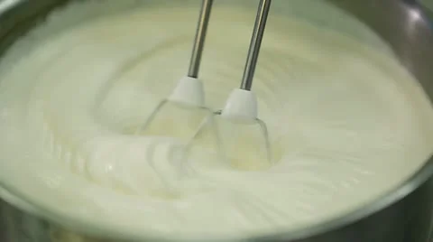 Electric mixer whisk cream Stock Footage