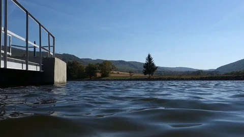 Electric model of a ship on a lake surface Stock Footage 107835069