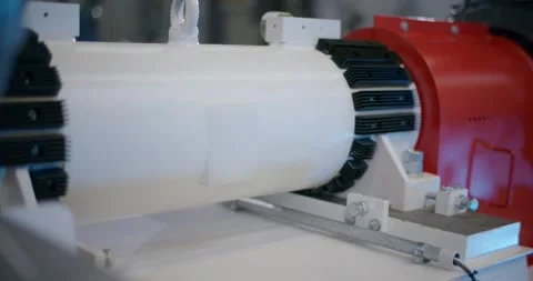 Electric Motor Coupled to White Polymer Cylinder, Close Up Detail Stock Footage 340345748