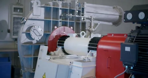 Electric Motor Driving White Roller, Engineering Workshop Test Bench, Wide Shot Stock Footage 340345429