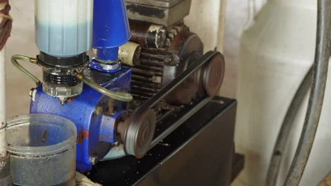 Electric motor vacuum pump running automated milking machine system on dairy far Video stock 342915376