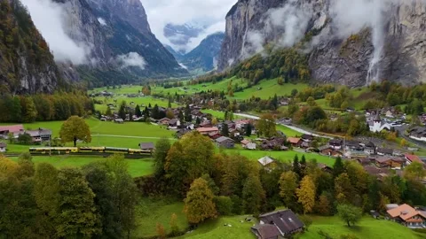 Electric Passenger Train with Snowy Jungfrau Mountains Stock Footage 305731153