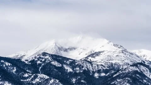 Electric Peak Mountain shrouded in clouds in winter timelapse Stock Footage 310538477