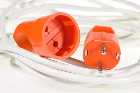 Electric plug and socket red color on white wires Stock Photos
