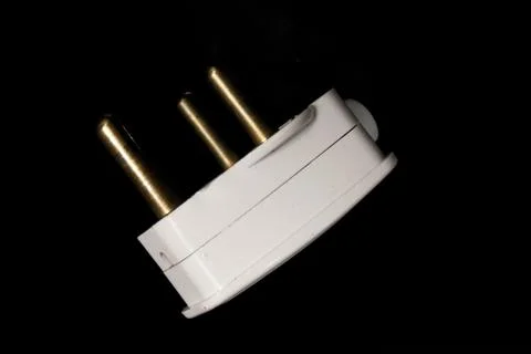 Electric Plug on black background with selective focus Stock Photos