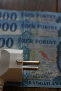 Electric plug on forint banknotes Fotos de archivo