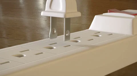An electric plug with  prongs is inserted into an outlet strip Stock Footage 62200300