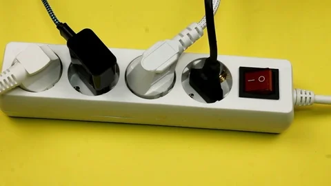 Electric plug in a socket close-up. Big shallow DOF. Remove the plugs into elect Stock Footage 84074469