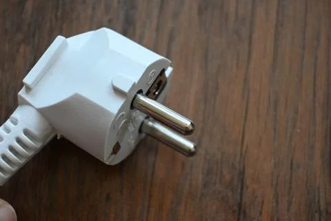 Electric plug on a wooden surface Fotos de archivo
