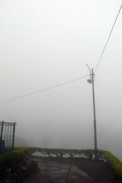 Electric Pole in the Mist Stock Photos