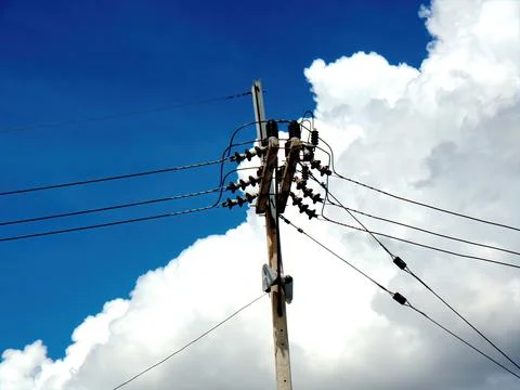 Electric pole in the white cloud background Stock Photos